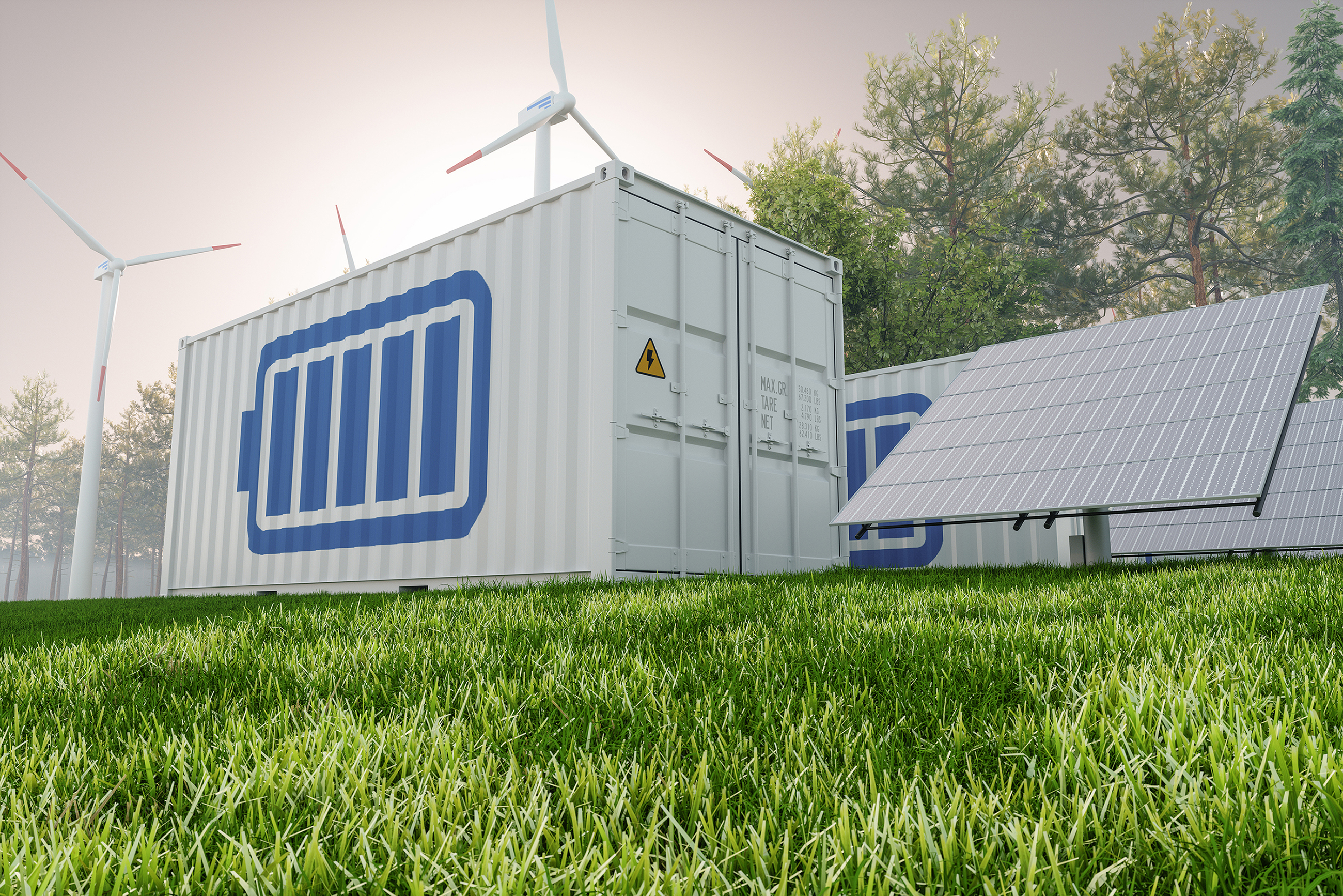Large scale storage batteries next to solar panels and wind turbines